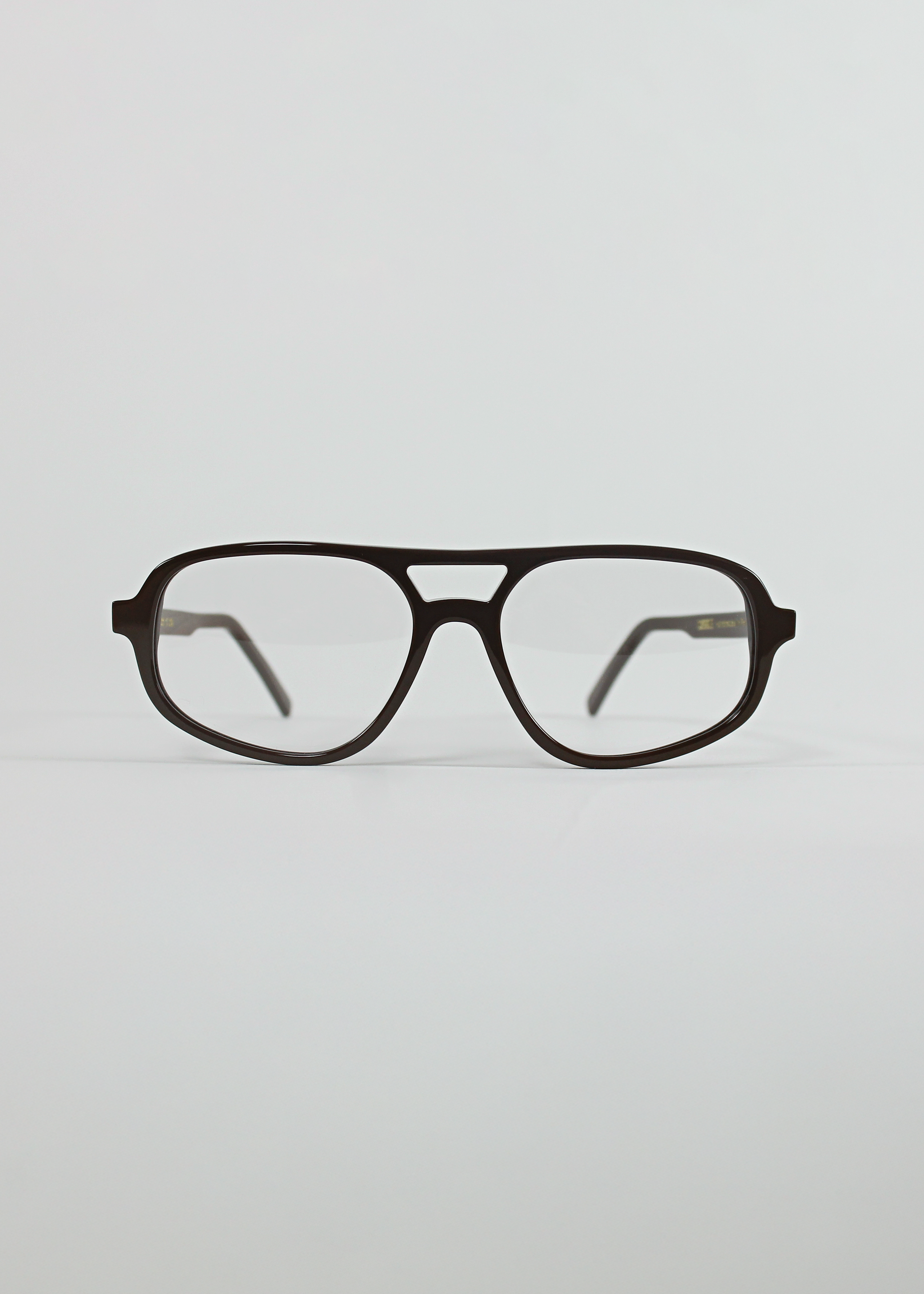 Black eyeglasses on a light gray background