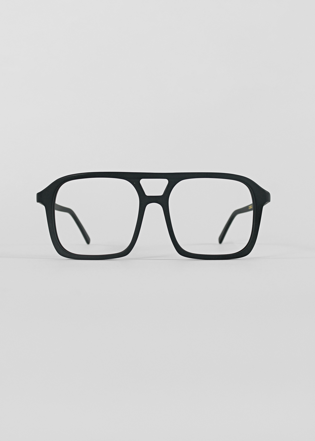 Black eyeglasses on a light gray background