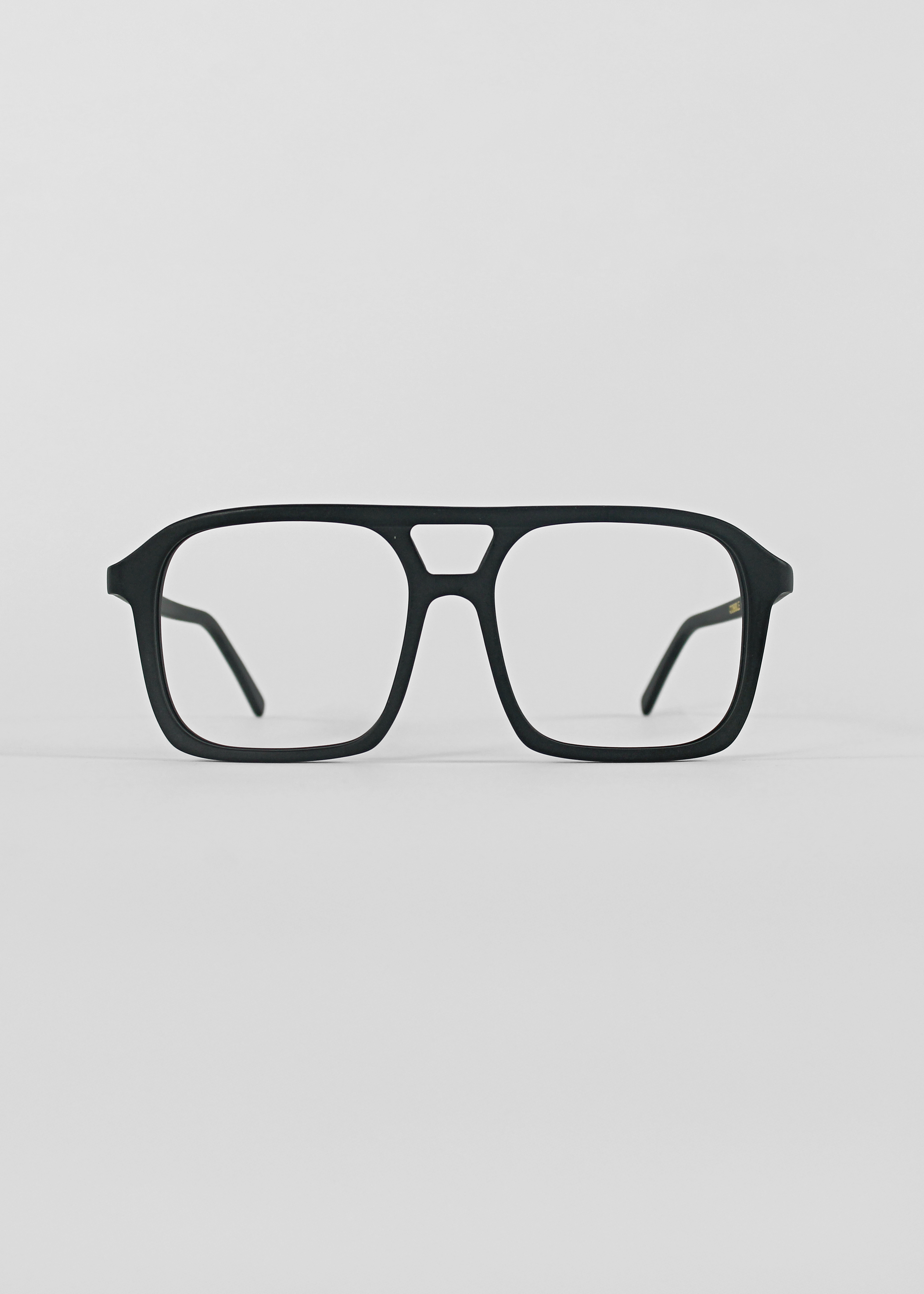 Black eyeglasses on a light gray background