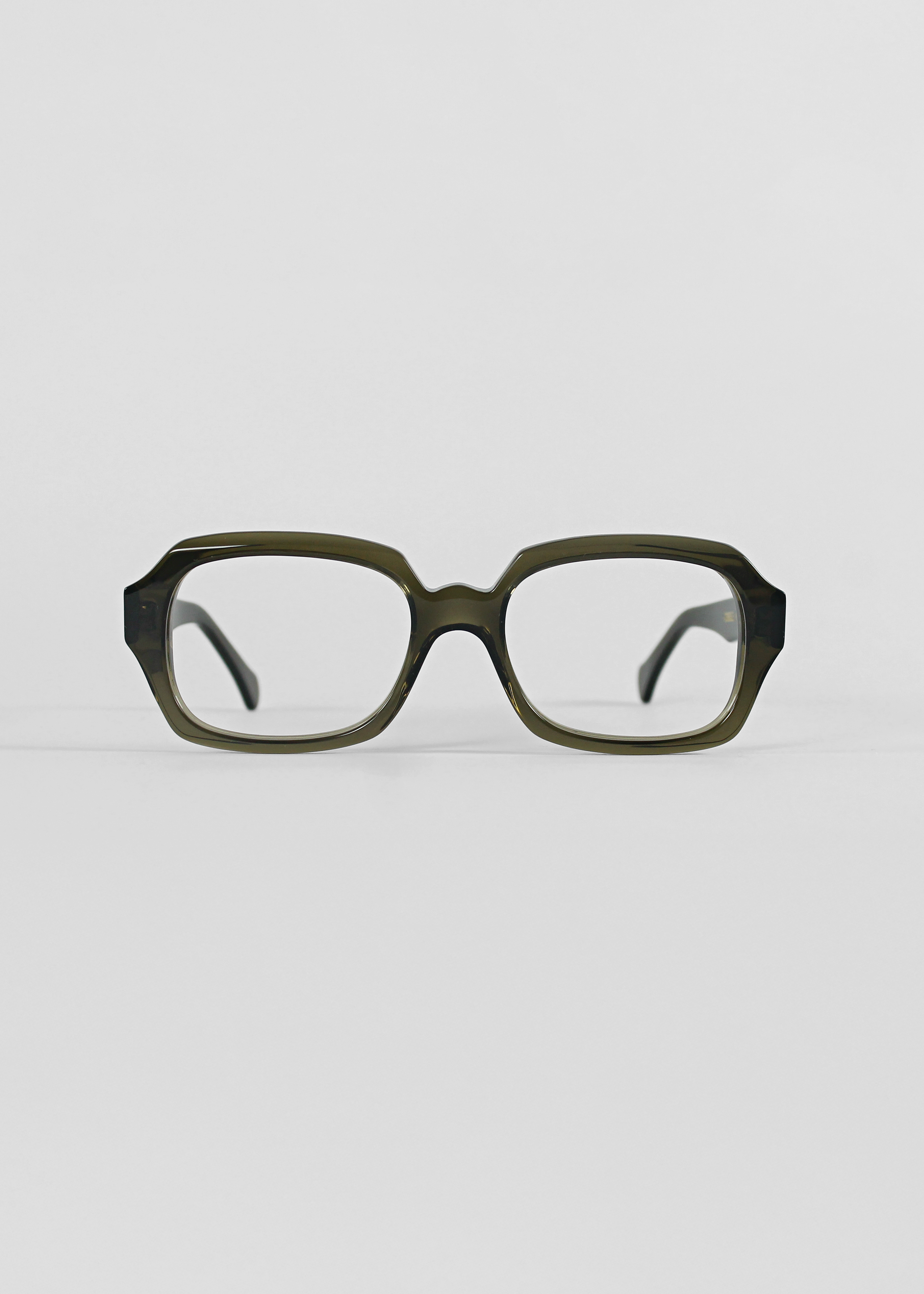 Pair of glasses on a light gray background